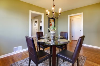 Classic dining room with leather chairs and glass table clipart