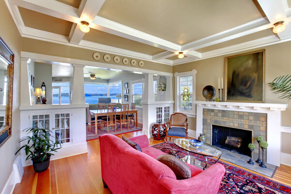 Brown living room with red sofa interior.