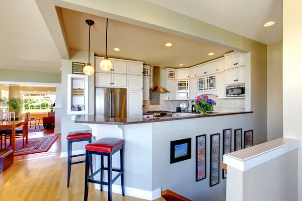 Kitchen interior design. White cabinets and bar. — Stock Photo, Image