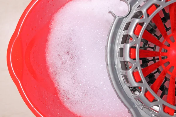 Bucket with foamy water — Stock Photo, Image