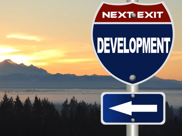Development road sign — Stock Photo, Image