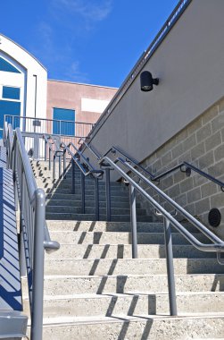 Steps leading upwards into a building clipart