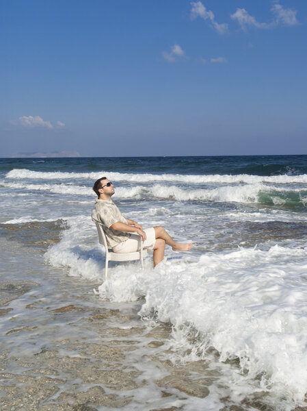 Summer vacation: Happy man near sea