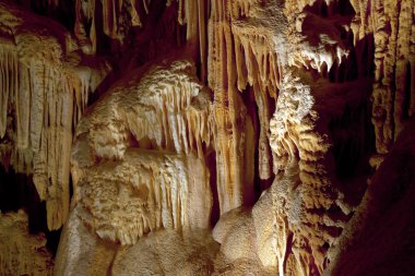 Huge stalagtites in a cave clipart