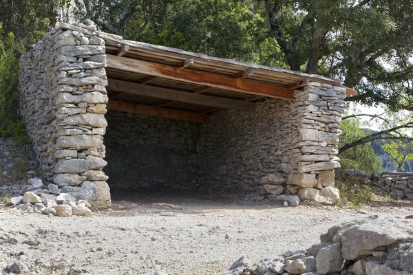 stock image Old ruined stone shelter in the countryside