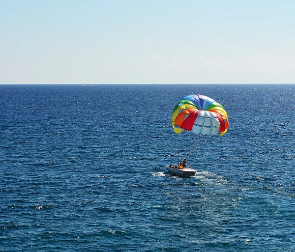 stock image Colored parachute over a sea