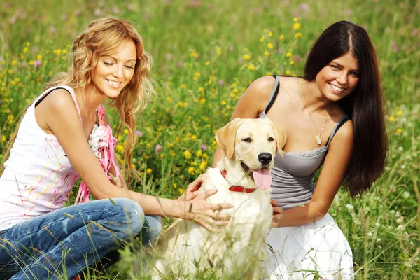 Girlfriends and dog Royalty Free Stock Photos
