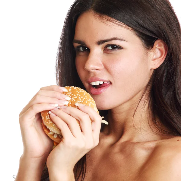 Kobieta zjeść hamburgera — Zdjęcie stockowe