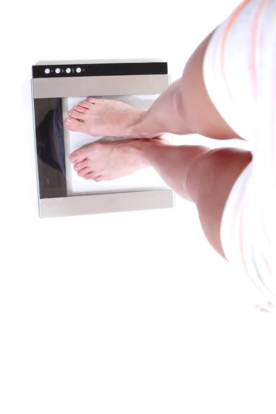 Legs on scales — Stock Photo, Image