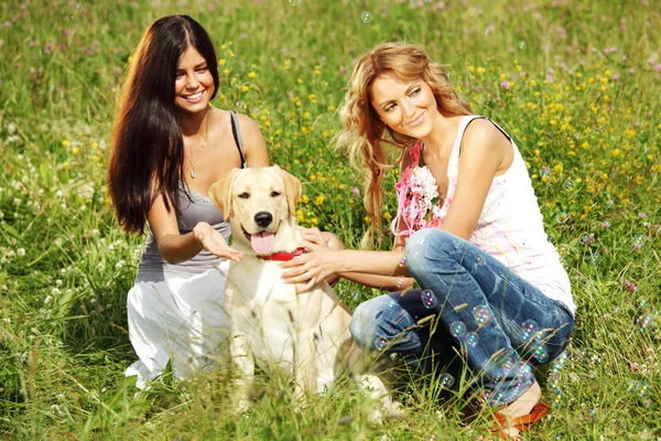 Girlfriends and dog Royalty Free Stock Photos