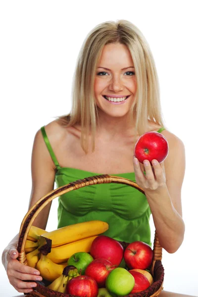 Woman holds a basket of fruit — Stock Photo, Image