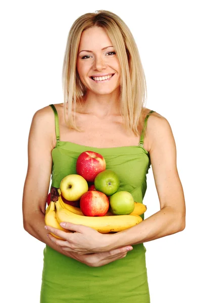 Frau hält einen Haufen Obst in der Hand — Stockfoto