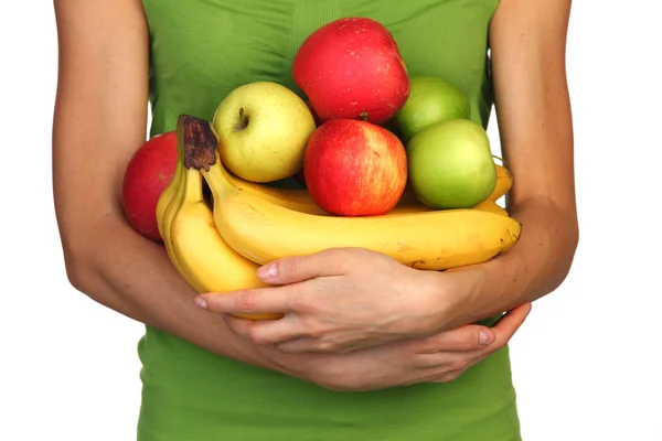 Woman holds a pile of fruit — Stock Photo, Image