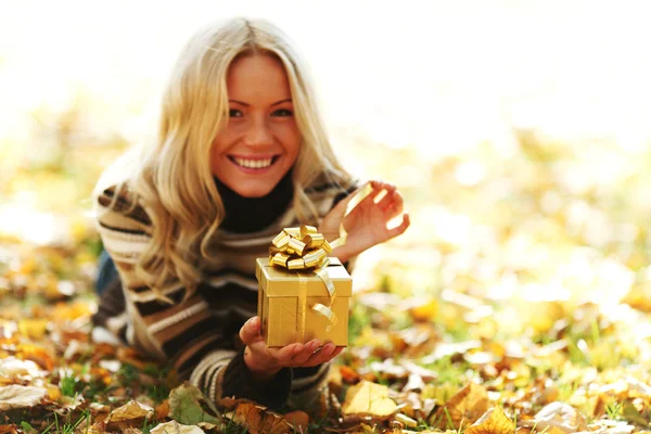 Woman take autumn gift — Stock Photo, Image