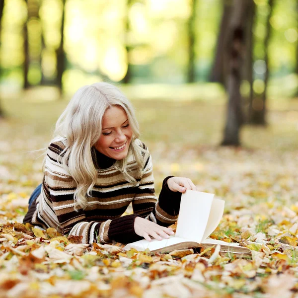 Woman read in park Stock Image