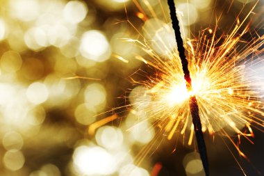 Sparkler on bokeh background clipart