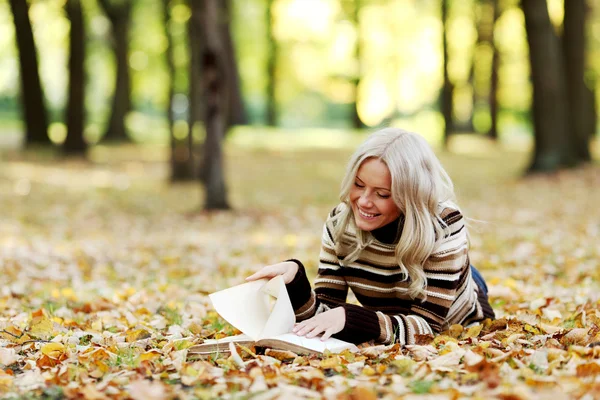 Woman read in park Stock Image