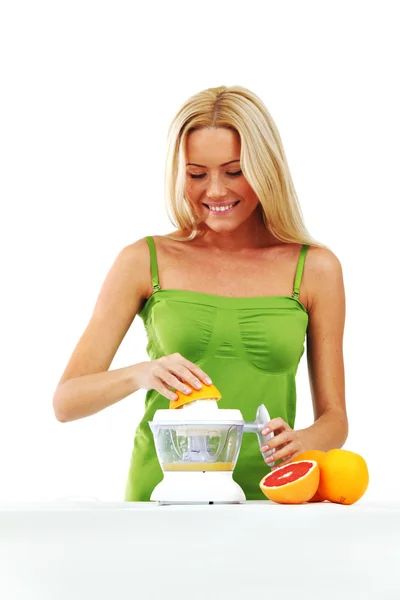 Woman squeezes juice — Stock Photo, Image
