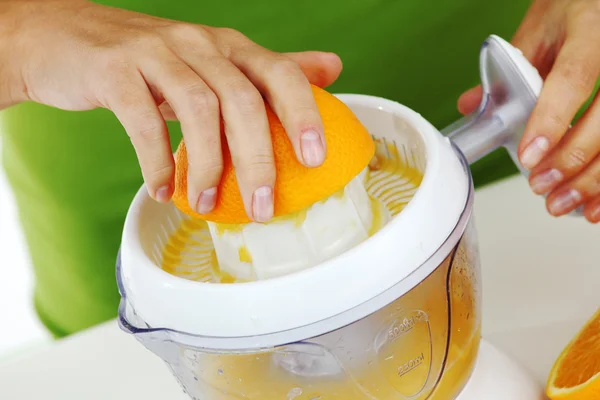 Stock image Woman squeezes juice