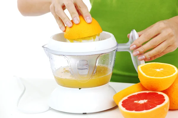 stock image Woman squeezes juice