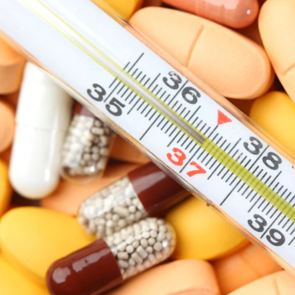 stock image Thermometer and drugs