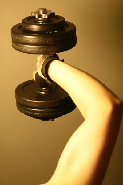 Dumbbell in hand — Stock Photo, Image