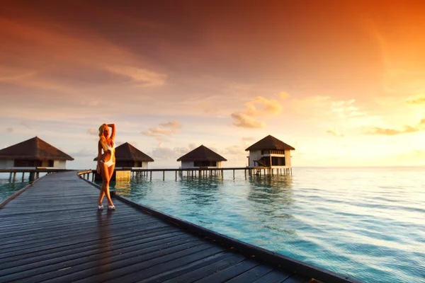 Woman in a dress on maldivian sunset — Stock Photo, Image
