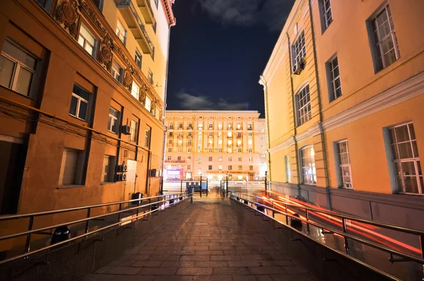 Night view from the court into the lighted street.JPG — Stock Photo, Image