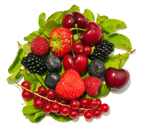 stock image A lot of different berries and green leaves on white background