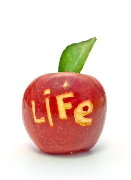 Word of life cut out on a red apple — Stock Photo, Image
