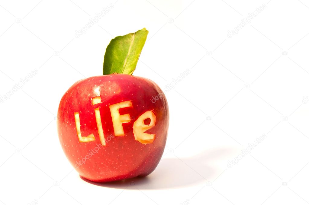 Word of life cut out on a red apple