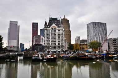 View of the canal in Rotterdam on a cloudy day clipart