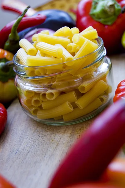 Jar with penne pasta — Stock Photo, Image