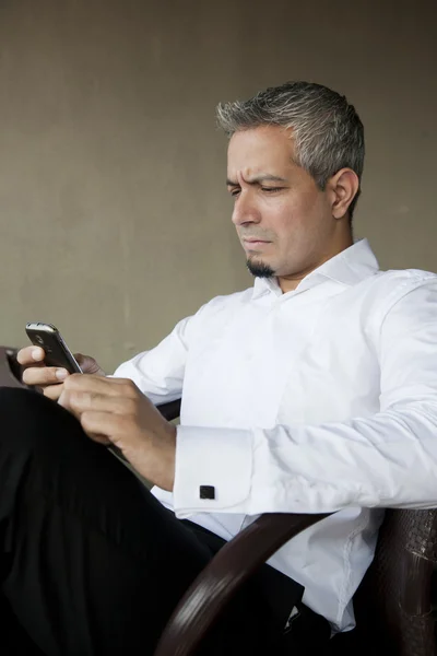 Portrait of a young businessman using his mobile phone — Stock Photo, Image