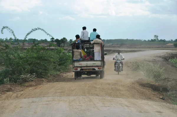 stock image Travelling by truck on unpaved road in India