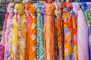 Multicolor shawls and scarves. clipart