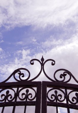 Sky view through gates. clipart