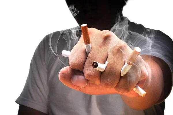 Egy ember ököl tele cigaretta Jogdíjmentes Stock Képek