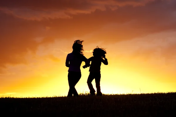 Dancing a jig at sunset. — Stock Photo, Image