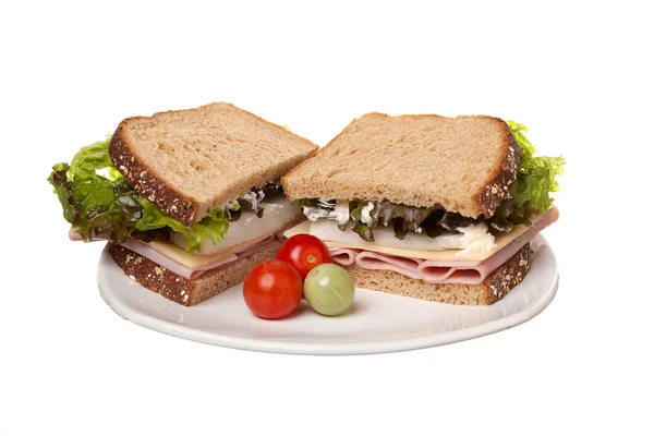 Ham sandwich and cherry tomatoes. — Stock Photo, Image