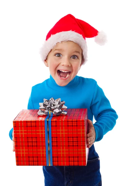 Chico risueño en sombrero de Santa con caja roja Imágenes De Stock Sin Royalties Gratis