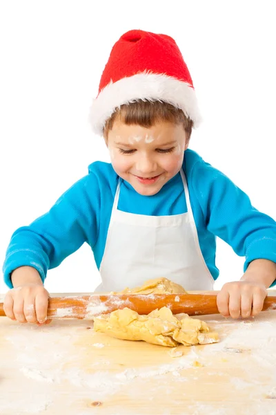 Smiling little bot kneading for Christmas cooking — Stock Photo, Image