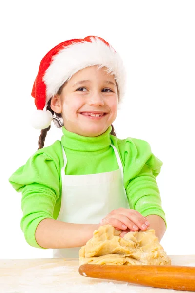 Smiling little girl kneading for Christmas cooking — Stock Photo, Image