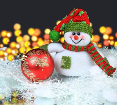 Festive snowman with Christmas light background clipart