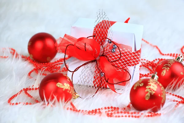 Christmas gift with red balls isolated on white background — Stok fotoğraf