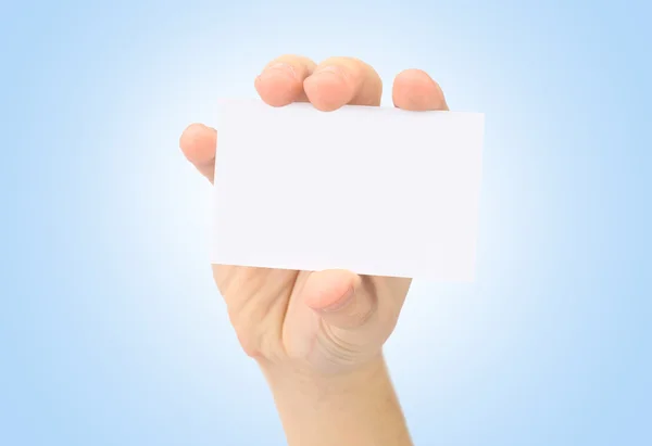 Hand and a card isolated on blue — Stok fotoğraf