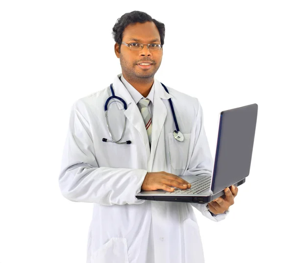 Beautiful african-american doctor, holding the laptop. Isolated on a white — Stockfoto
