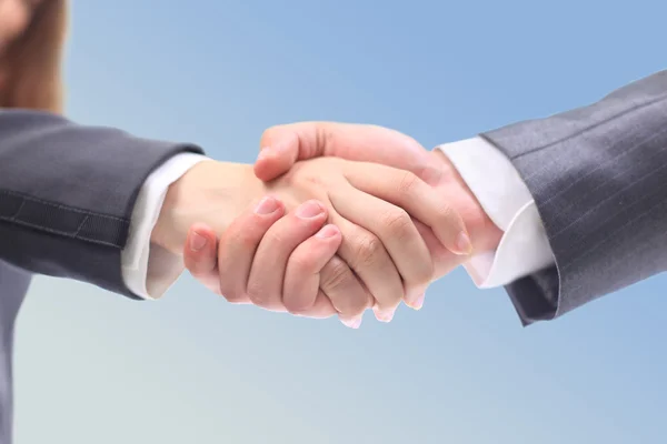 Handshake businessmen. On the blue background. — Stock Photo, Image