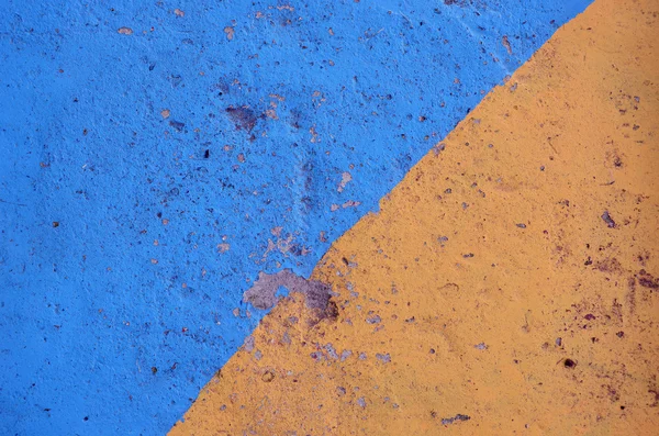 Fondo de hormigón pintado azul y amarillo — Foto de Stock