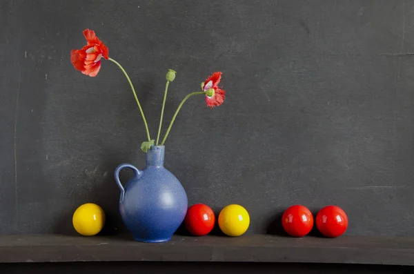 Still-life with poppy and colorful balls — Stock Photo, Image